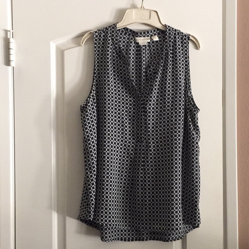 Sleeveless black and white blouse